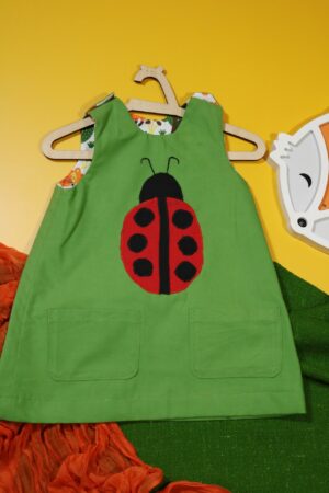 Zielona sukienka dwustronna z biedronką (86 cm)