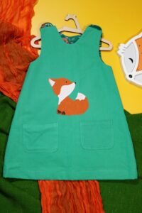 Zielona sukienka dwustronna z lisem (116 cm)